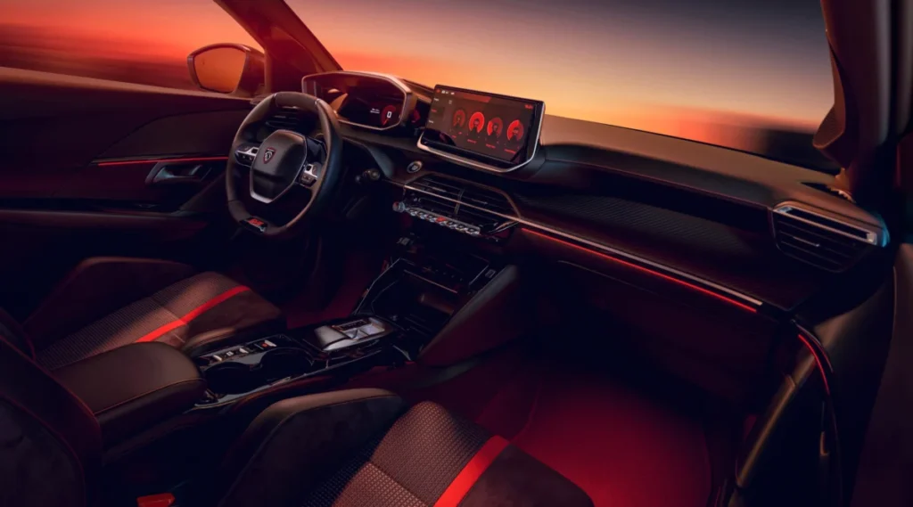 Olvídate del aburrido coche eléctrico: el heredero del Peugeot 205 GTi ya tiene precio Imagen que muestra el interior del nuevo PEUGEOT E-208 GTi salpicadero conductor y copiloto
